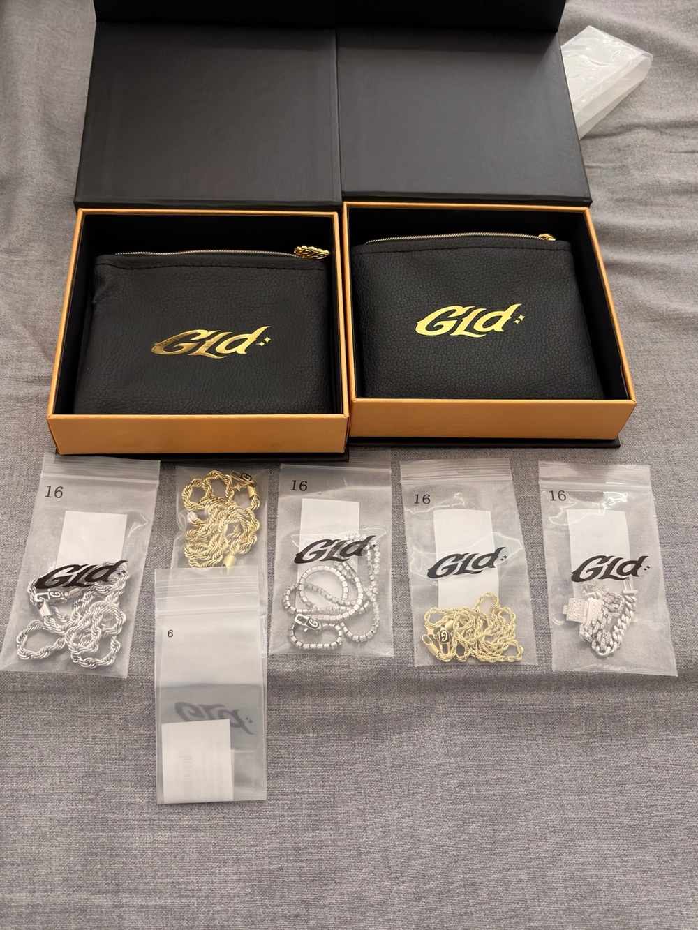 GLD Black & Gold Pouches with Mixed Chains and bracelets